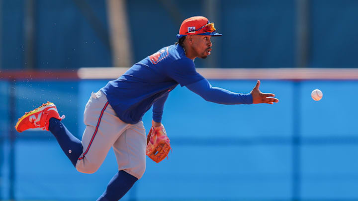 Feb 15, 2025; Port St. Lucie, FL, USA; New York Mets shortstop Francisco Lindor (12) works on a fielding exercise during a spring training workout at Clover Park. Feb 15, 2025; Port St. Lucie, FL, USA; New York Mets shortstop Francisco Lindor (12) works on a fielding exercise during a spring training workout at Clover Park.
