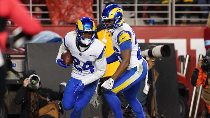 Dec 12, 2024; Santa Clara, California, USA; Los Angeles Rams cornerback Darious Williams (24) reacts with safety Kamren Kinchens (26) after intercepting a pass against the San Francisco 49ers in the fourth quarter at Levi's Stadium. Mandatory Credit: Cary Edmondson-Imagn Images