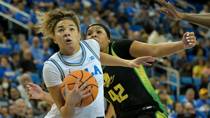 Dec 7, 2025; Los Angeles, California, USA; UCLA Bruins guard Kiki Rice (1) drives past Oregon Ducks guard Avary Cain (42) during the first half at Pauley Pavilion presented by Wescom Financial. Mandatory Credit: Jayne Kamin-Oncea-Imagn Images Dec 7, 2025; Los Angeles, California, USA; UCLA Bruins guard Kiki Rice (1) drives past Oregon Ducks guard Avary Cain (42) during the first half at Pauley Pavilion presented by Wescom Financial. Mandatory Credit: Jayne Kamin-Oncea-Imagn Images