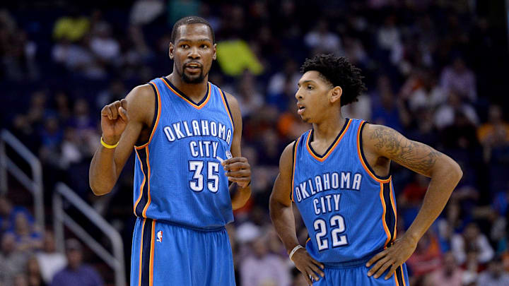 Feb 8, 2016; Phoenix, AZ, USA; Oklahoma City Thunder forward Kevin Durant (35) and guard Cameron Payne (22) talk at half court during the game against the Phoenix Suns at Talking Stick Resort Arena. Oklahoma City won 122- 106. Mandatory Credit: Jennifer Stewart-Imagn Images