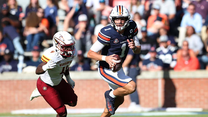 Nov 16, 2024; Auburn, Alabama, USA;  Louisiana Monroe Warhawks linebacker Travor Randle (4) chases Auburn Tigers quarterback Payton Thorne (1) during the third quarter at Jordan-Hare Stadium. Mandatory Credit: John Reed-Imagn Images