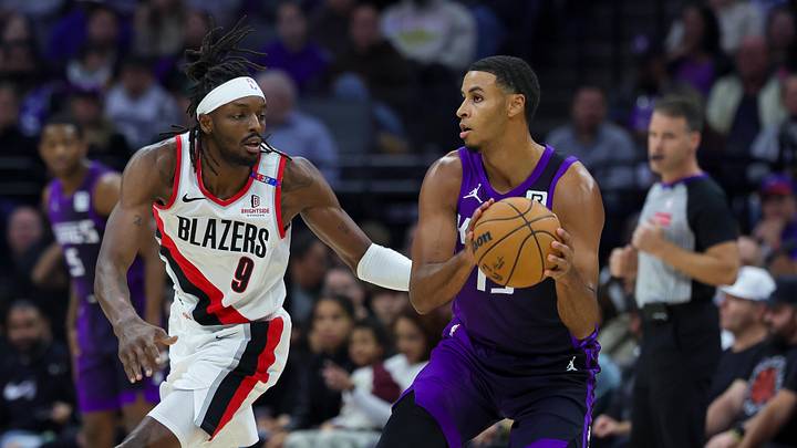 Oct 28, 2024; Sacramento, California, USA; Sacramento Kings guard Kevin Huerter (9) controls the ball against Portland Trail Blazers forward Jerami Grant (9) during the first quarter at Golden 1 Center. Mandatory Credit: Sergio Estrada-Imagn Images