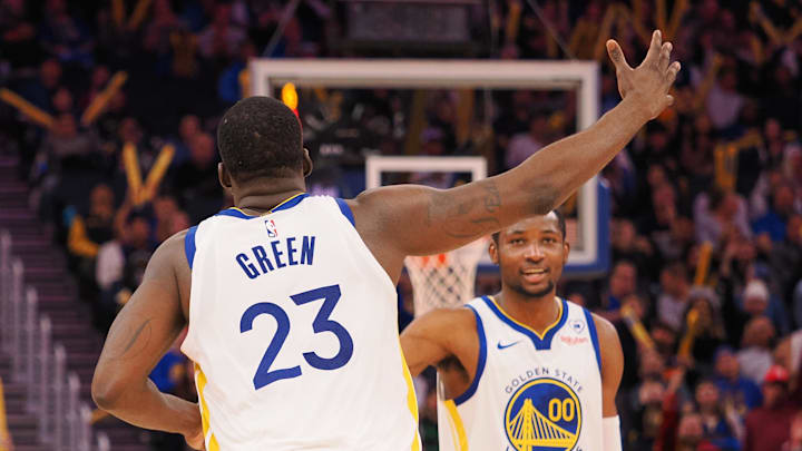 Jan 24, 2024; San Francisco, California, USA; Golden State Warriors forward Draymond Green (23) celebrates with forward Jonathan Kuminga (00) after a play against the Atlanta Hawks during the fourth quarter at Chase Center. Mandatory Credit: Kelley L Cox-Imagn Images