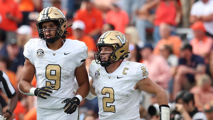Nov 2, 2024; Auburn, Alabama, USA;  Vanderbilt Commodores quarterback Diego Pavia (2) celebrates with tight end Eli Stowers (9) after a touchdown during the fourth quarter against the Auburn Tigers at Jordan-Hare Stadium. Mandatory Credit: John Reed-Imagn Images