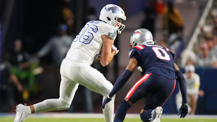 Oct 5, 2025; Orchard Park, NY; Dalton Kincaid  makes a catch against Patriots cornerback Christian Gonzalez