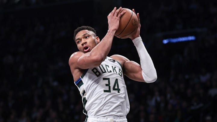 Dec 27, 2023; Brooklyn, New York, USA; Milwaukee Bucks forward Giannis Antetokounmpo (34) rebounds during the first quarter against the Brooklyn Nets at Barclays Center. Mandatory Credit: Vincent Carchietta-Imagn Images
