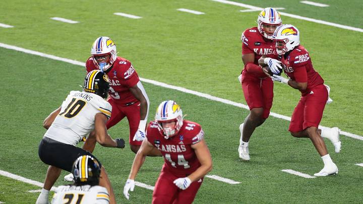 Kansas Jayhawks quarterback Isaiah Marshall (8) hands the ball to Kansas Jayhawks running back Dylan Edwards (1) during the game inside David Booth Kansas Memorial Stadium on Sept. 11, 2026. Kansas Jayhawks quarterback Isaiah Marshall (8) hands the ball to Kansas Jayhawks running back Dylan Edwards (1) during the game inside David Booth Kansas Memorial Stadium on Sept. 11, 2026.