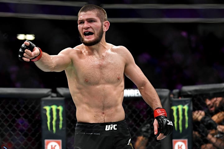 Khabib Nurmagomedov (red gloves) reacts after his fight against Conor McGregor (blue gloves) during UFC 229 at T-Mobile Arena
