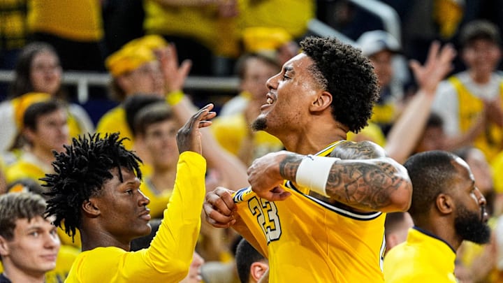 Michigan forward Yaxel Lendeborg (23) celebrates a play as he walks off the court for substitution during the second half against Michigan State at Crisler Center in Ann Arbor on Sunday, March 8, 2026.