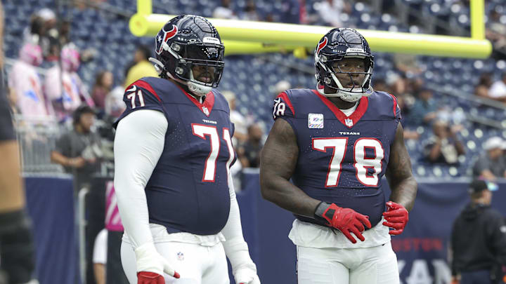 Oct 15, 2023; Houston, Texas, USA; Houston Texans offensive tackle Tytus Howard (71) and offensive tackle Laremy Tunsil (78) warm up before the game against the New Orleans Saints at NRG Stadium. Mandatory Credit: Troy Taormina-Imagn Images