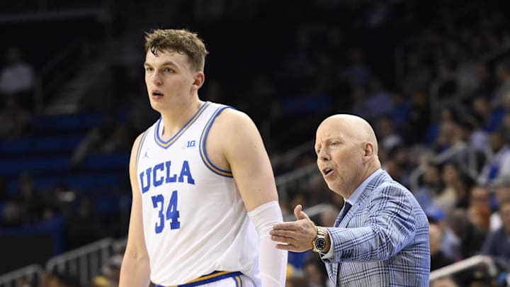 Feb 18, 2025; Los Angeles, California, USA; UCLA Bruins head coach Mick Cronin talks to forward Tyler Bilodeau (34) during the second half at Pauley Pavilion presented by Wescom. Mandatory Credit: Robert Hanashiro-Imagn Images