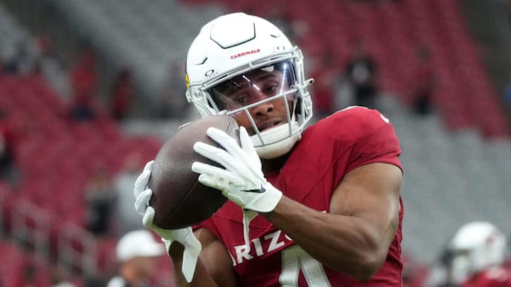 Arizona Cardinals receiver Rondale Moore (4) warms up before their game against the Atlanta Falcons at State Farm Stadium in Glendale on Nov. 12, 2023.