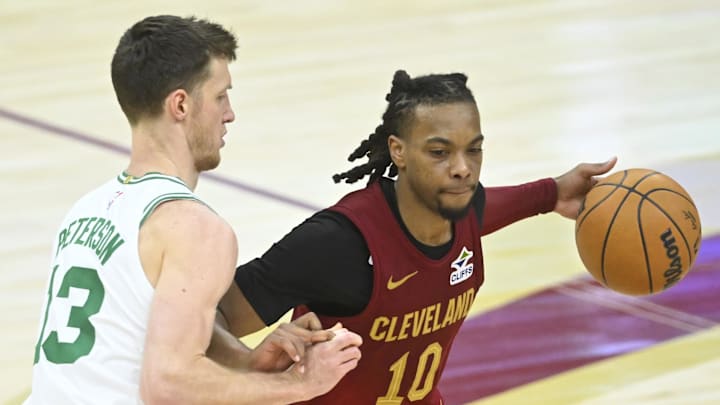 Dec 1, 2024; Cleveland, Ohio, USA; Boston Celtics forward Drew Peterson (13) defends Cleveland Cavaliers guard Darius Garland (10) in the third quarter at Rocket Mortgage FieldHouse. Mandatory Credit: David Richard-Imagn Images