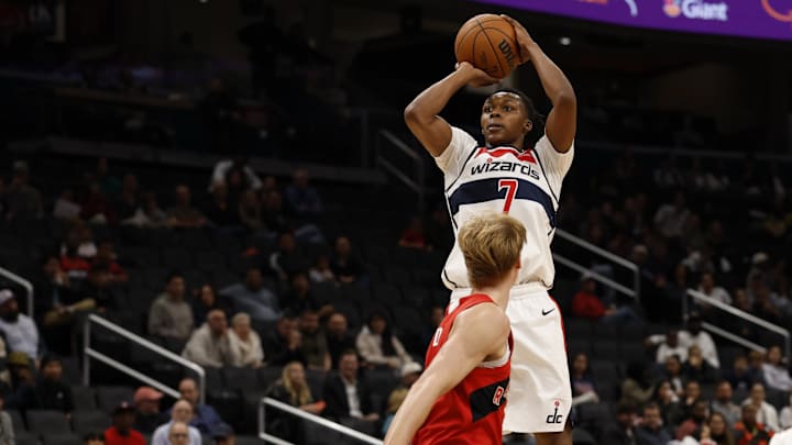 Oct 12, 2025; Washington, District of Columbia, USA; Washington Wizards guard Bub Carrington (7) shoots the ball over Toronto Raptors guard/forward Gradey Dick (1) in the second half at Capital One Arena. Mandatory Credit: Geoff Burke-Imagn Images