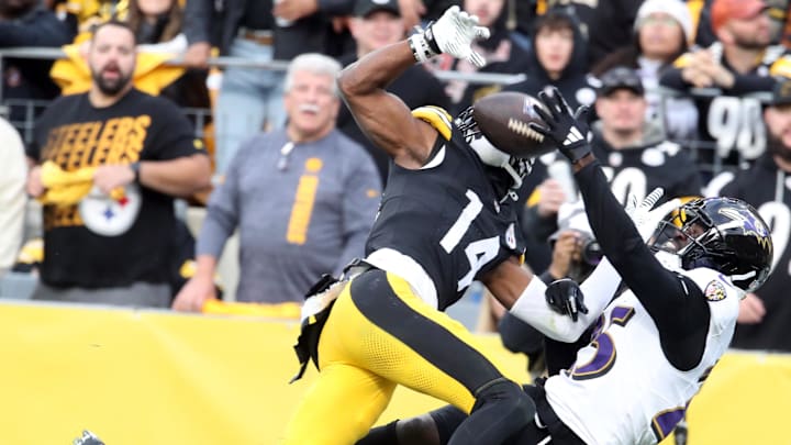 Nov 17, 2024; Pittsburgh, Pennsylvania, USA;  Baltimore Ravens cornerback Tre'Davious White (25) breaks up a pass in the end-zone intended for Pittsburgh Steelers wide receiver George Pickens (14) during the fourth quarter at Acrisure Stadium. Mandatory Credit: Charles LeClaire-Imagn Images