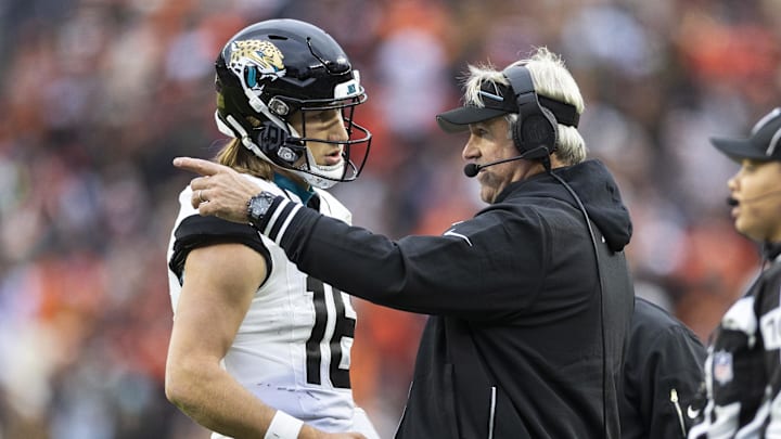 Dec 10, 2023; Cleveland, Ohio, USA; Jacksonville Jaguars head coach Doug Pederson talks with quarterback Trevor Lawrence (16) during the third quarter against the Cleveland Browns at Cleveland Browns Stadium. 
