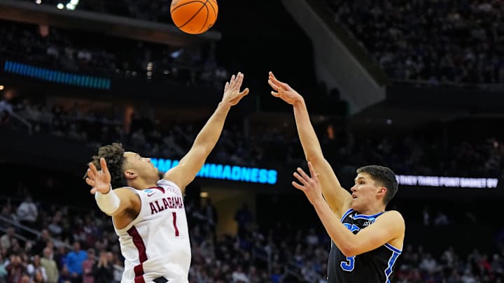 Mar 27, 2025; Newark, NJ, USA; Brigham Young Cougars guard Egor Demin (3) shoots the ball against Alabama Crimson Tide guard Mark Sears (1) during the first half during an East Regional semifinal of the 2025 NCAA tournament at Prudential Center. Mandatory Credit: Robert Deutsch-Imagn Images Mar 27, 2025; Newark, NJ, USA; Brigham Young Cougars guard Egor Demin (3) shoots the ball against Alabama Crimson Tide guard Mark Sears (1) during the first half during an East Regional semifinal of the 2025 NCAA tournament at Prudential Center. Mandatory Credit: Robert Deutsch-Imagn Images