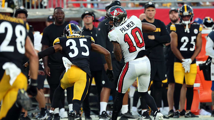 Aug 11, 2023; Tampa, Florida, USA; Tampa Bay Buccaneers wide receiver Trey Palmer (10) catches the ball as Pittsburgh Steelers cornerback Luq Barcoo (35) defends during the first half at Raymond James Stadium. Aug 11, 2023; Tampa, Florida, USA; Tampa Bay Buccaneers wide receiver Trey Palmer (10) catches the ball as Pittsburgh Steelers cornerback Luq Barcoo (35) defends during the first half at Raymond James Stadium.