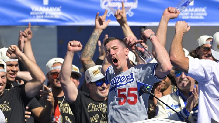 Nov 1, 2024; Los Angeles, CA, USA;  Los Angeles Dodgers starting pitcher Walker Buehler (21) speaks to fans during the World Series Championship Celebration at Dodger Stadium. Mandatory Credit: Jayne Kamin-Oncea-Imagn Images