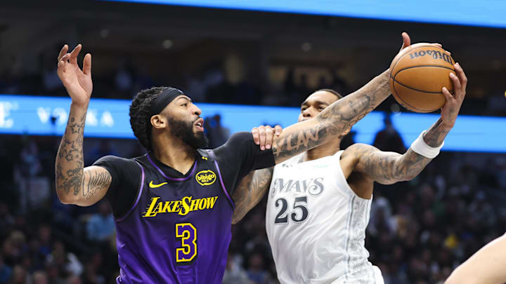 Jan 7, 2025; Dallas, Texas, USA; Los Angeles Lakers forward Anthony Davis (3) blocks the shot of Dallas Mavericks forward P.J. Washington (25) during the first half at American Airlines Center. Mandatory Credit: Kevin Jairaj-Imagn Images