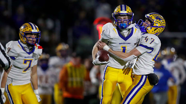 Rice Lake High School's Zach Orr (1) celebrates with Jack Larson (47) after intercepting a pass against West De Pere on November 15, 2024.