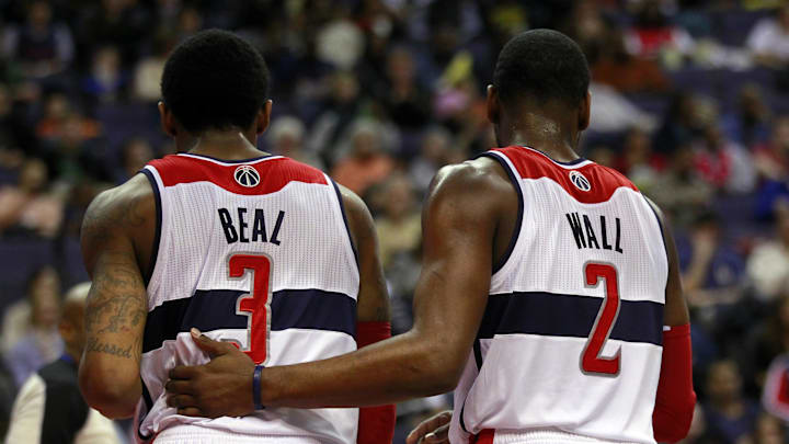 March 3, 2013; Washington, DC, USA; Washington Wizards point guard John Wall (2) talks with Wizards shooting guard Bradley Beal (3) against the Philadelphia 76ers in the fourth quarter at Verizon Center. The Wizards won 90-87. Mandatory Credit: Geoff Burke-Imagn Images