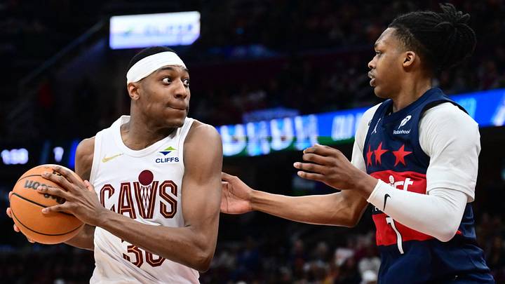 Apr 12, 2026; Cleveland, Ohio, USA; Cleveland Cavaliers forward Nae'qwan Tomlin (35) drives to the basket against Washington Wizards guard Bub Carrington (7) during the second half at Rocket Arena. Mandatory Credit: Ken Blaze-Imagn Images Apr 12, 2026; Cleveland, Ohio, USA; Cleveland Cavaliers forward Nae'qwan Tomlin (35) drives to the basket against Washington Wizards guard Bub Carrington (7) during the second half at Rocket Arena. Mandatory Credit: Ken Blaze-Imagn Images