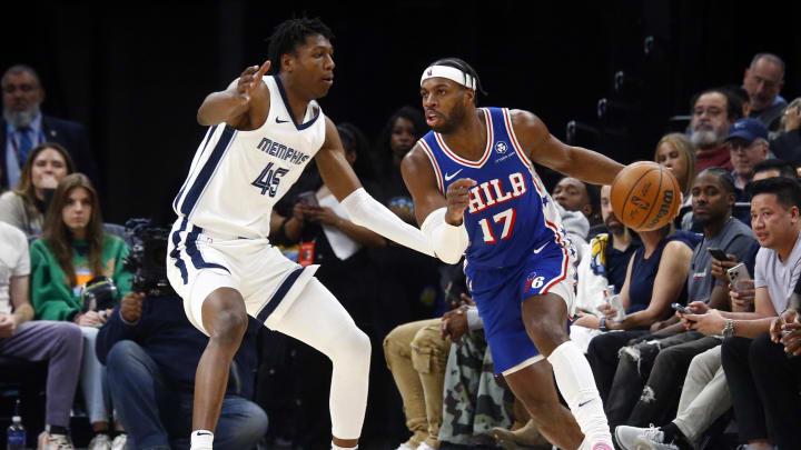 Apr 6, 2024; Memphis, Tennessee, USA; Philadelphia 76ers guard Buddy Hield (17) drives to the basket as Memphis Grizzlies forward GG Jackson (45) defends during the second half at FedExForum. Mandatory Credit: Petre Thomas-USA TODAY Sports