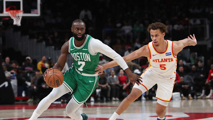 Mar 30, 2026; Atlanta, Georgia, USA; Boston Celtics guard Jaylen Brown (7) dribbles against Atlanta Hawks guard Dyson Daniels (5) in the first half at State Farm Arena. Mandatory Credit: Mady Mertens-Imagn Images