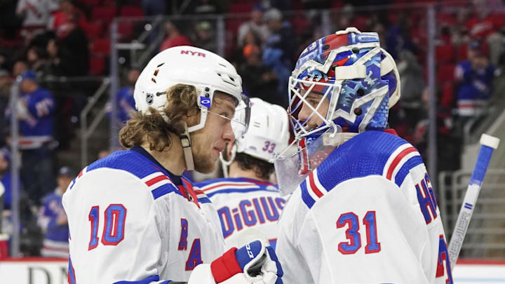 Feb 21, 2020; Raleigh, North Carolina, USA;  New York Rangers goaltender Igor Shesterkin (31) and left wing Artemi Panarin (10) celebrate there win against the Carolina Hurricanes at PNC Arena. The New York Rangers defeated the Carolina Hurricanes 5-2. Mandatory Credit: James Guillory-Imagn Images
