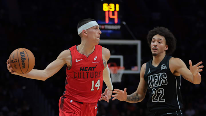 Dec 23, 2024; Miami, Florida, USA; Miami Heat guard Tyler Herro (14) protects the basketball from Brooklyn Nets forward Jalen Wilson (22) during the second quarter at Kaseya Center. Mandatory Credit: Sam Navarro-Imagn Images Dec 23, 2024; Miami, Florida, USA; Miami Heat guard Tyler Herro (14) protects the basketball from Brooklyn Nets forward Jalen Wilson (22) during the second quarter at Kaseya Center. Mandatory Credit: Sam Navarro-Imagn Images