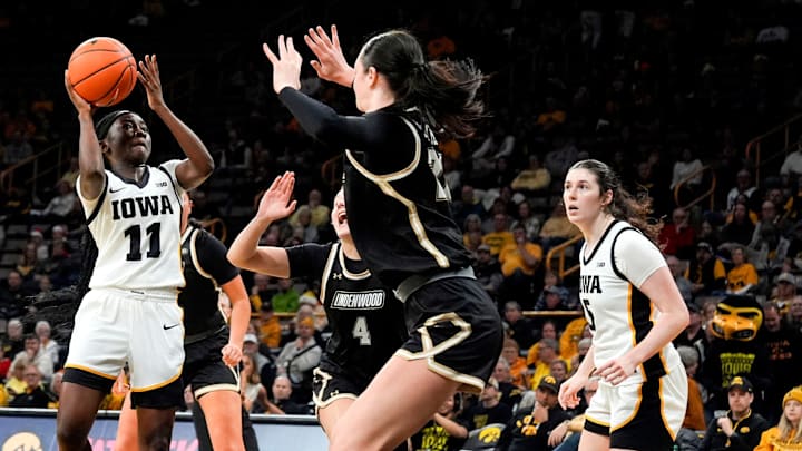 Iowa guard Chit-Chat Wright (11) drives to the basket against the Lindenwood Lions Dec. 13, 2025 at Carver-Hawkeye Arena in Iowa City, Iowa. Iowa guard Chit-Chat Wright (11) drives to the basket against the Lindenwood Lions Dec. 13, 2025 at Carver-Hawkeye Arena in Iowa City, Iowa.