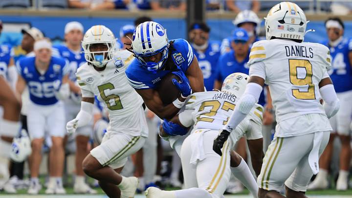Dec 27, 2025; Orlando, FL, USA; BYU Cougars wide receiver Jojo Phillips (13) runs with the ball as Georgia Tech Yellow Jackets defensive back Tae Harris (27) defends during the first half at Camping World Stadium. Mandatory Credit: Kim Klement Neitzel-Imagn Images Dec 27, 2025; Orlando, FL, USA; BYU Cougars wide receiver Jojo Phillips (13) runs with the ball as Georgia Tech Yellow Jackets defensive back Tae Harris (27) defends during the first half at Camping World Stadium. Mandatory Credit: Kim Klement Neitzel-Imagn Images