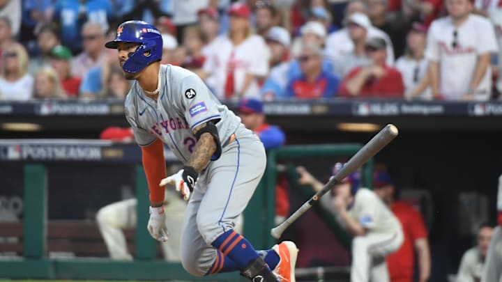 New York Mets third baseman Mark Vientos (27) hits a RBI single against the Philadelphia Phillies in the eighth inning in game one of the NLDS for the 2024 MLB Playoffs at Citizens Bank Park on Oct 5.