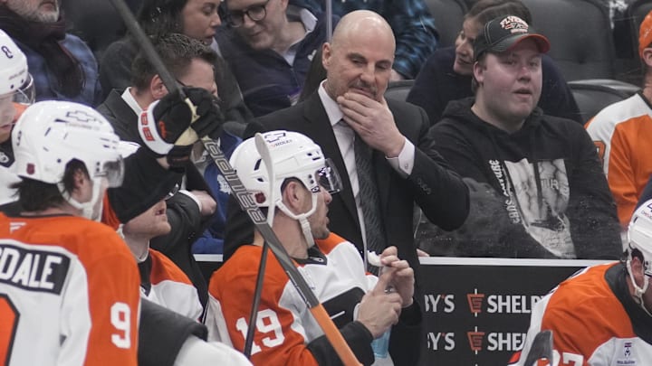 Mar 2, 2026; Toronto, Ontario, CAN; Philadelphia Flyers head coach Rick Tocchet talks with forward Garnet Hathaway (19) during a break in the action against the Toronto Maple Leafs at Scotiabank Arena.