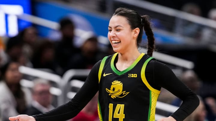 Oregon Ducks guard Ari Long (14) smiles while running to the bench Thursday, March 5, 2026, during a Big Ten women's basketball tournament game at Gainbridge Fieldhouse in Indianapolis. The Oregon Ducks defeated the Maryland Terrapins, 73-68. Oregon Ducks guard Ari Long (14) smiles while running to the bench Thursday, March 5, 2026, during a Big Ten women's basketball tournament game at Gainbridge Fieldhouse in Indianapolis. The Oregon Ducks defeated the Maryland Terrapins, 73-68.