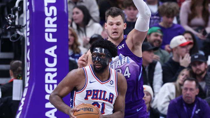 Dec 28, 2024; Salt Lake City, Utah, USA; Philadelphia 76ers center Joel Embiid (21) posts up against Utah Jazz center Walker Kessler (24) during the fourth quarter at Delta Center. Mandatory Credit: Rob Gray-Imagn Images