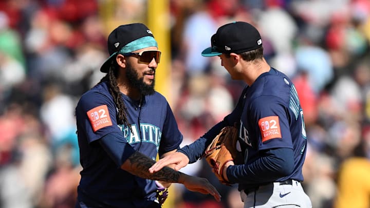 Seattle Mariners shortstop J.P. Crawford (3) and third base Ben Williamson (9) high-five after a game against the Boston Red Sox at Fenway Park on April 24. Seattle Mariners shortstop J.P. Crawford (3) and third base Ben Williamson (9) high-five after a game against the Boston Red Sox at Fenway Park on April 24.