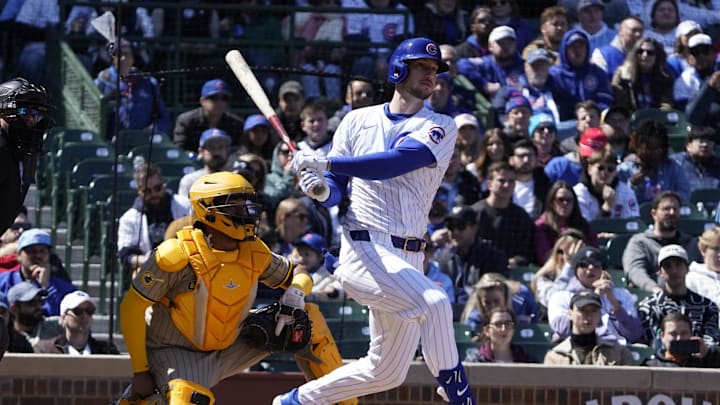 Chicago, Illinois, USA; Chicago Cubs outfielder Kyle Tucker (30) hits a one run single against the San Diego Padres during the first inning at Wrigley Field.