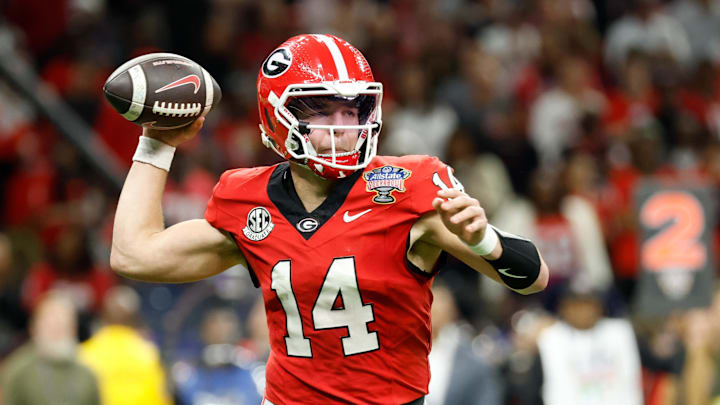 Jan 1, 2026; New Orleans, LA, USA; Georgia Bulldogs quarterback Gunner Stockton (14) passes the ball against the Mississippi Rebels in the second quarter during the 2026 Sugar Bowl and quarterfinal game of the College Football Playoff at Caesars Superdome. Mandatory Credit: Amber Searls-Imagn Images Jan 1, 2026; New Orleans, LA, USA; Georgia Bulldogs quarterback Gunner Stockton (14) passes the ball against the Mississippi Rebels in the second quarter during the 2026 Sugar Bowl and quarterfinal game of the College Football Playoff at Caesars Superdome. Mandatory Credit: Amber Searls-Imagn Images