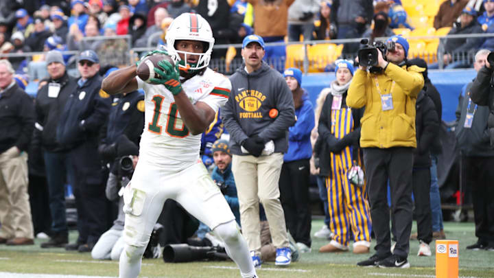 Nov 29, 2025; Pittsburgh, Pennsylvania, USA; Miami Hurricanes wide receiver Malachi Toney (10) catches a touchdown pass against the Pittsburgh Panthers during the second quarter at Acrisure Stadium. Mandatory Credit: Charles LeClaire-Imagn Images Nov 29, 2025; Pittsburgh, Pennsylvania, USA; Miami Hurricanes wide receiver Malachi Toney (10) catches a touchdown pass against the Pittsburgh Panthers during the second quarter at Acrisure Stadium. Mandatory Credit: Charles LeClaire-Imagn Images