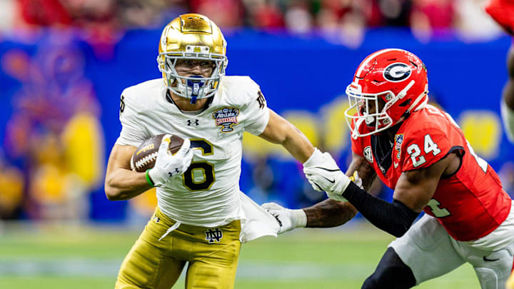 Jan 2, 2025; New Orleans, LA, USA; Notre Dame Fighting Irish wide receiver Jordan Faison (6) is tackled by Georgia Bulldogs defensive back Malaki Starks (24) during the second half at Caesars Superdome. Mandatory Credit: Stephen Lew-Imagn Images Jan 2, 2025; New Orleans, LA, USA; Notre Dame Fighting Irish wide receiver Jordan Faison (6) is tackled by Georgia Bulldogs defensive back Malaki Starks (24) during the second half at Caesars Superdome. Mandatory Credit: Stephen Lew-Imagn Images