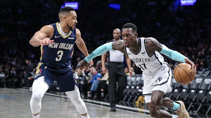 Mar 19, 2024; Brooklyn, New York, USA;  Brooklyn Nets guard Dennis Schroder (17) drives past New Orleans Pelicans guard CJ McCollum (3) in the third quarter at Barclays Center. Mandatory Credit: Wendell Cruz-Imagn Images