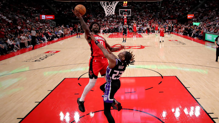 Mar 1, 2025; Houston, Texas, USA; Houston Rockets forward Tari Eason (17) drives to the basket against Sacramento Kings guard Keon Ellis (23) during the fourth quarter at Toyota Center. Mandatory Credit: Erik Williams-Imagn Images
