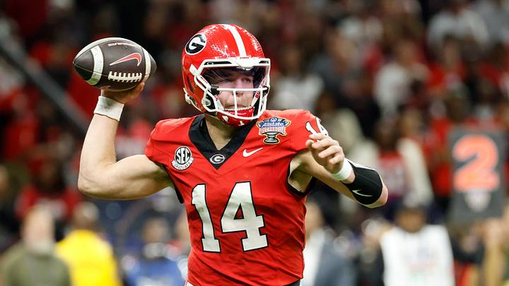 Jan 1, 2026; New Orleans, LA, USA; Georgia Bulldogs quarterback Gunner Stockton (14) passes the ball against the Mississippi Rebels in the second quarter during the 2026 Sugar Bowl and quarterfinal game of the College Football Playoff at Caesars Superdome. Mandatory Credit: Amber Searls-Imagn Images Jan 1, 2026; New Orleans, LA, USA; Georgia Bulldogs quarterback Gunner Stockton (14) passes the ball against the Mississippi Rebels in the second quarter during the 2026 Sugar Bowl and quarterfinal game of the College Football Playoff at Caesars Superdome. Mandatory Credit: Amber Searls-Imagn Images