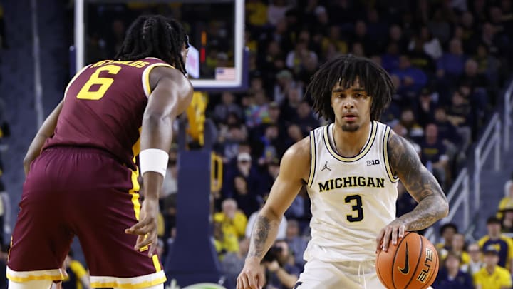 Feb 24, 2026; Ann Arbor, Michigan, USA; Michigan Wolverines guard Elliot Cadeau (3) dribbles against Minnesota Golden Gophers guard Langston Reynolds (6) in the first half at Crisler Center. Mandatory Credit: Rick Osentoski-Imagn Images Feb 24, 2026; Ann Arbor, Michigan, USA; Michigan Wolverines guard Elliot Cadeau (3) dribbles against Minnesota Golden Gophers guard Langston Reynolds (6) in the first half at Crisler Center. Mandatory Credit: Rick Osentoski-Imagn Images