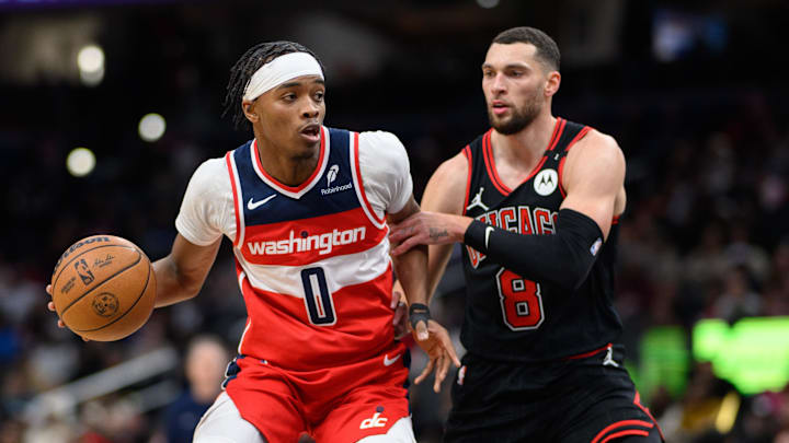 Jan 1, 2025; Washington, District of Columbia, USA; Washington Wizards guard Bilal Coulibaly (0) drives to the basket against Chicago Bulls guard Zach LaVine (8) during the first quarter at Capital One Arena. Mandatory Credit: Reggie Hildred-Imagn Images