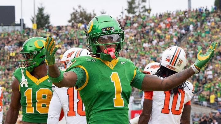 Oregon’s Dakorien Moore celebrates with Duck fans during the game against Oklahoma State. Oregon’s Dakorien Moore celebrates with Duck fans during the game against Oklahoma State.
