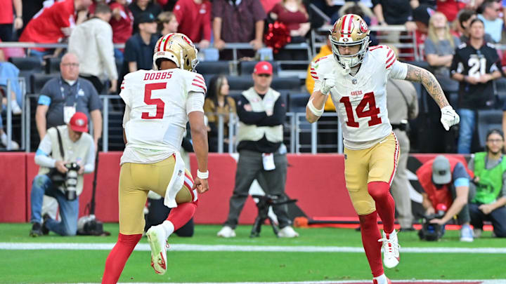 Jan 5, 2025; Glendale, Arizona, USA; San Francisco 49ers wide receiver Ricky Pearsall (14) and quarterback Joshua Dobbs (5) celebrate after connecting for a touchdown in the first half against the Arizona Cardinals at State Farm Stadium. Mandatory Credit: Matt Kartozian-Imagn Images