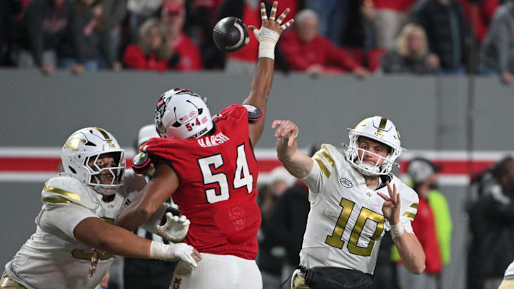 Nov 1, 2025; Raleigh, North Carolina, USA;  Georgia Tech Yellow Jackets quarterback Haynes King (10) throws a pass during the fourth quarter against the NC State Wolfpack at Carter-Finley Stadium. Mandatory Credit: Zachary Taft-Imagn Images